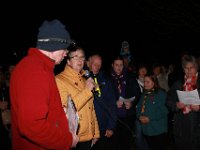 Battles Over 1  Parish Council chair Mark Fitzpatrick (in red) officiated. Councillor Wendy Rider (in yellow) read the first part of 'Tribute to the Millions'